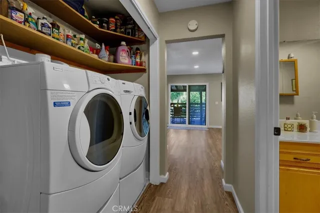 a bedroom with bed and a flat tv screen on dresser