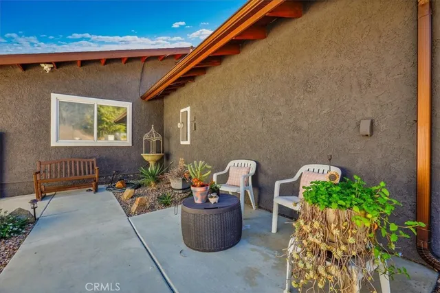 a view of a entryway with furniture and wooden floor