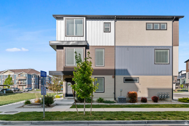8307 Durham Street Sandy, UT 84070 - Photo 29 of 29 Modern multi-story facade featuring varied textures including stucco, brick, and horizontal siding