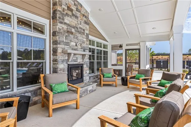a outdoor living space with patio furniture and a fireplace