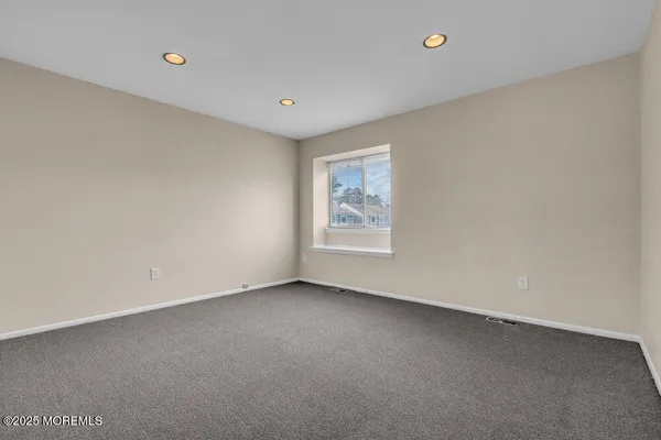 an empty room with a empty space and window