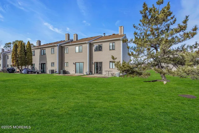 a view of house with yard