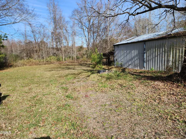 a backyard of house with trees