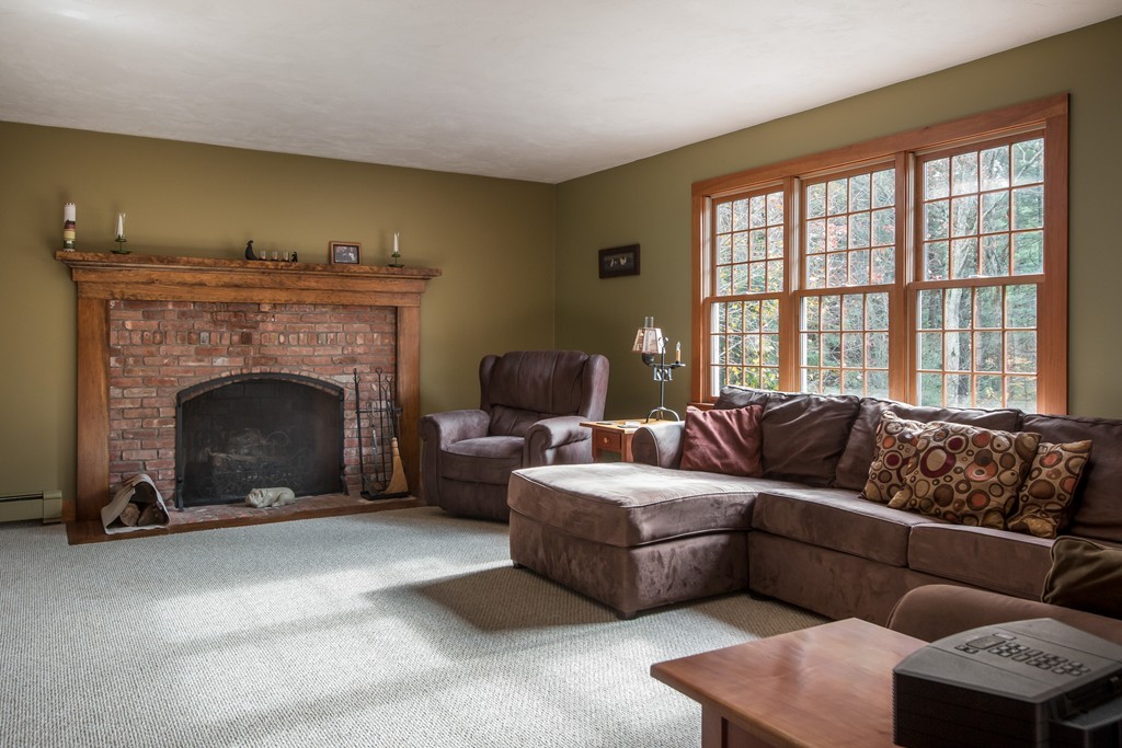 32 Blanchard Road Grafton, MA 01519 - Photo 15 of 30 a living room with furniture and a fireplace