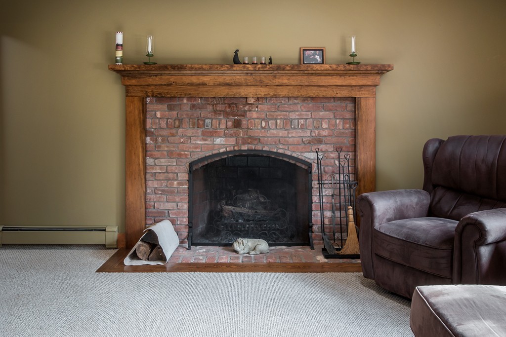 32 Blanchard Road Grafton, MA 01519 - Photo 18 of 30 a living room with furniture and a fireplace