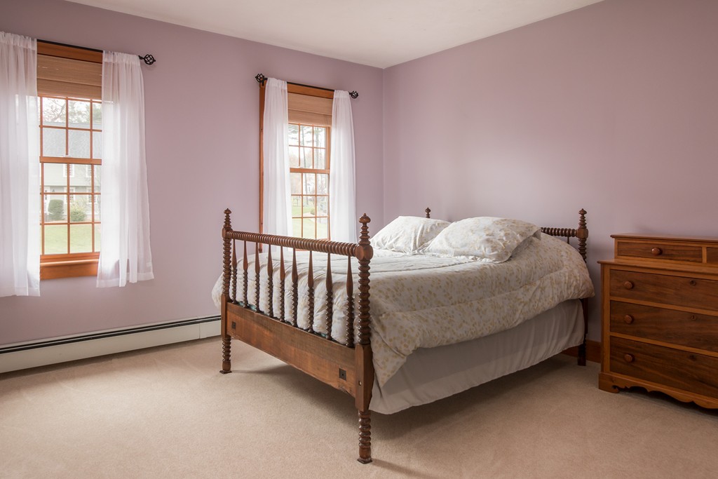 32 Blanchard Road Grafton, MA 01519 - Photo 20 of 30 a bed sitting in a bedroom next to a window