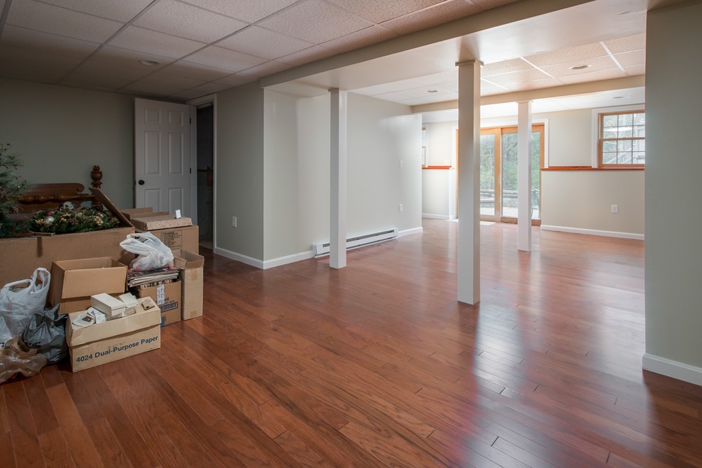 32 Blanchard Road Grafton, MA 01519 - Photo 27 of 30 a room with wooden floor and furniture