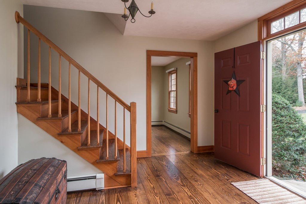 32 Blanchard Road Grafton, MA 01519 - Photo 7 of 30 a view of an entryway with wooden floor and stairs