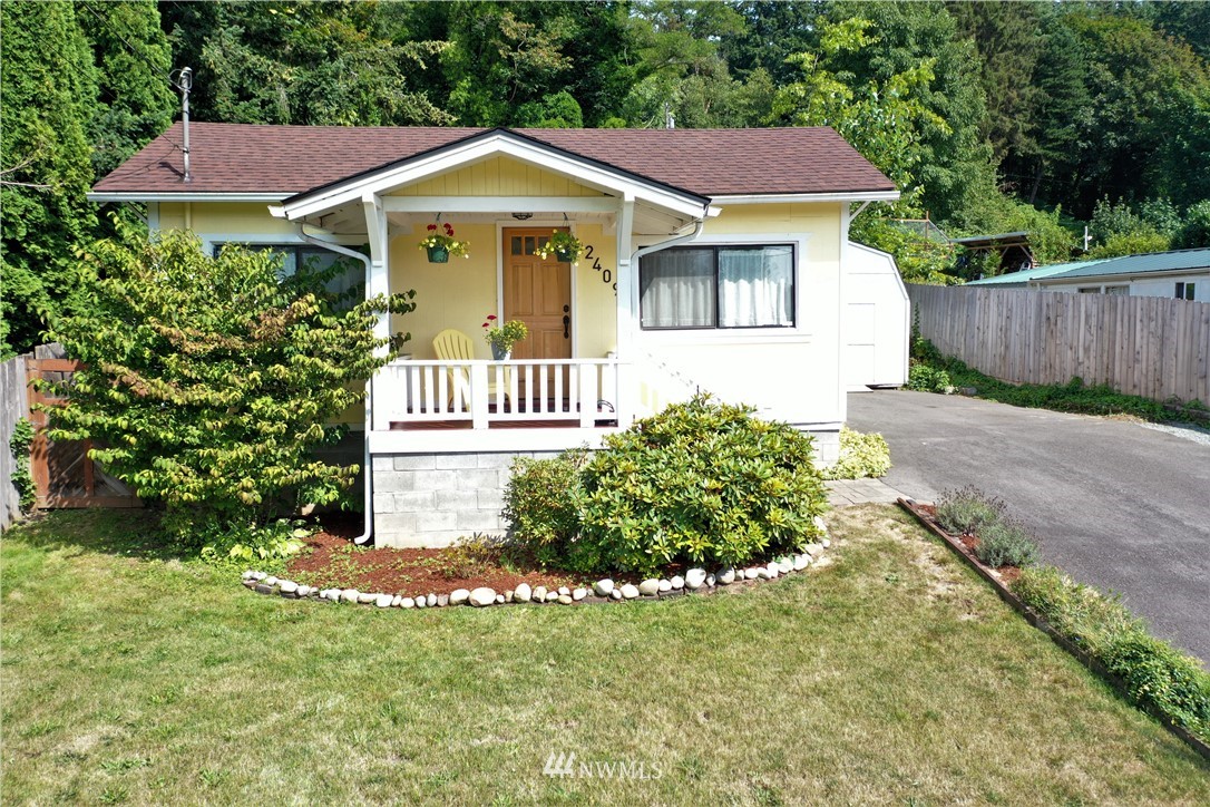 2409 Callow Road Lake Stevens, WA 98258 - Photo 1 of 16 a front view of a house with a yard