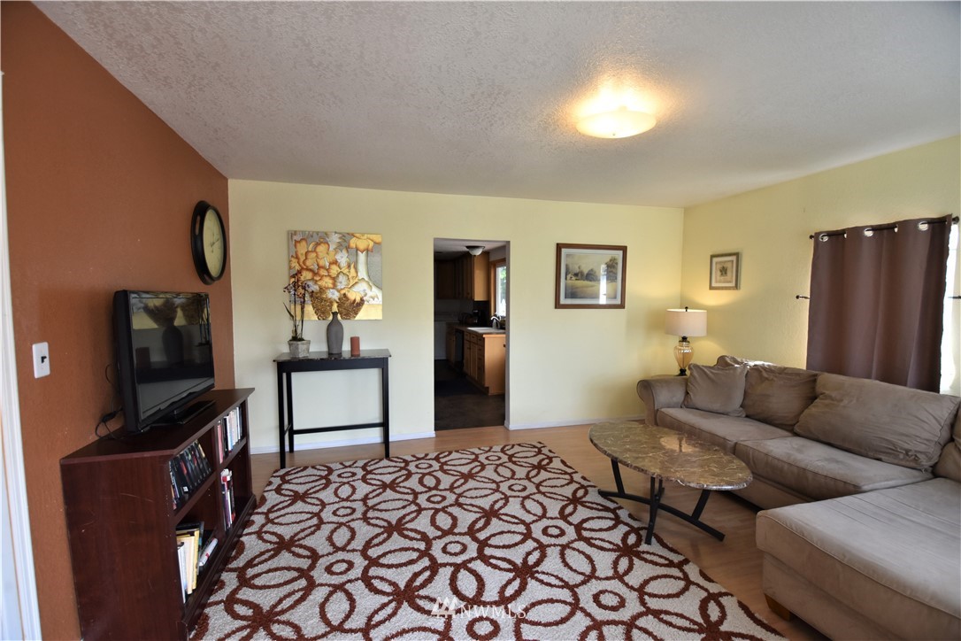 2409 Callow Road Lake Stevens, WA 98258 - Photo 5 of 16 a living room with furniture and a flat screen tv