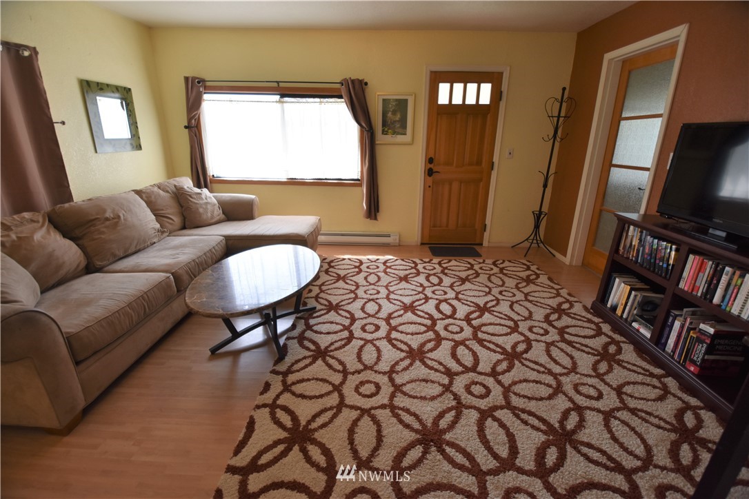 2409 Callow Road Lake Stevens, WA 98258 - Photo 6 of 16 a living room with a couch and a flat screen tv
