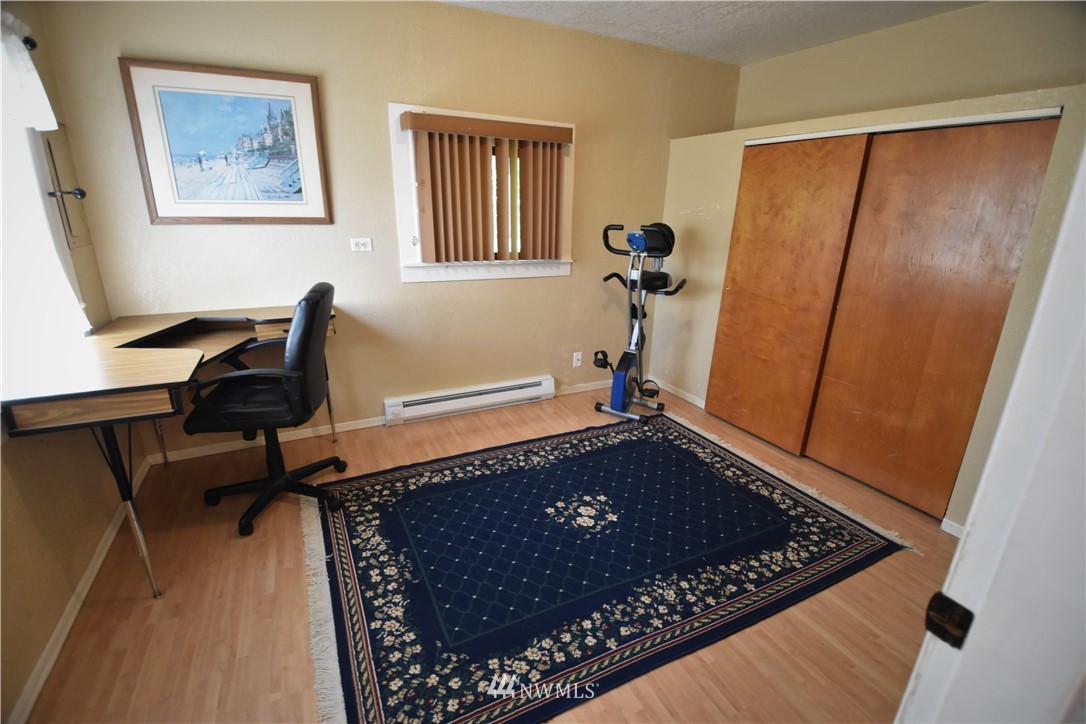 2409 Callow Road Lake Stevens, WA 98258 - Photo 7 of 16 a view of a hardwood floor and wardrobe