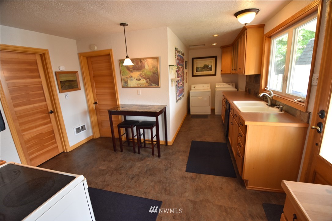 2409 Callow Road Lake Stevens, WA 98258 - Photo 8 of 16 a room with furniture a large window and wood floor