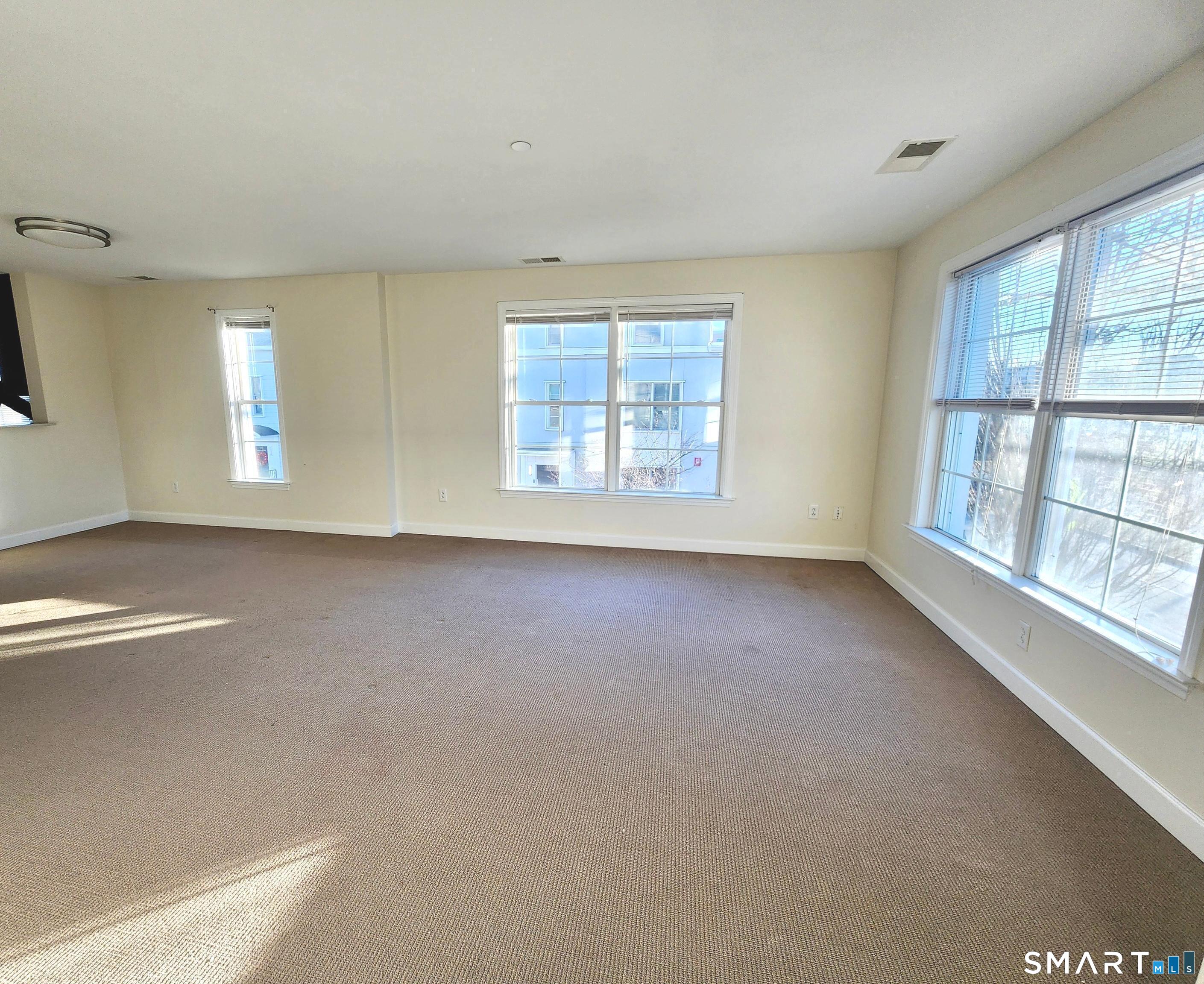 80 Merrell Avenue, Unit 80 Stamford, CT 06902 - Photo 8 of 14 New Carpet Being Installed