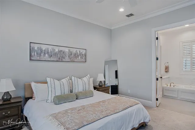 a bedroom with a bed and a walk in closet