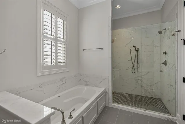 a bath tub sitting next to a shower