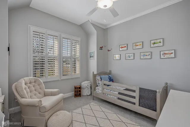 a bedroom with furniture and a window