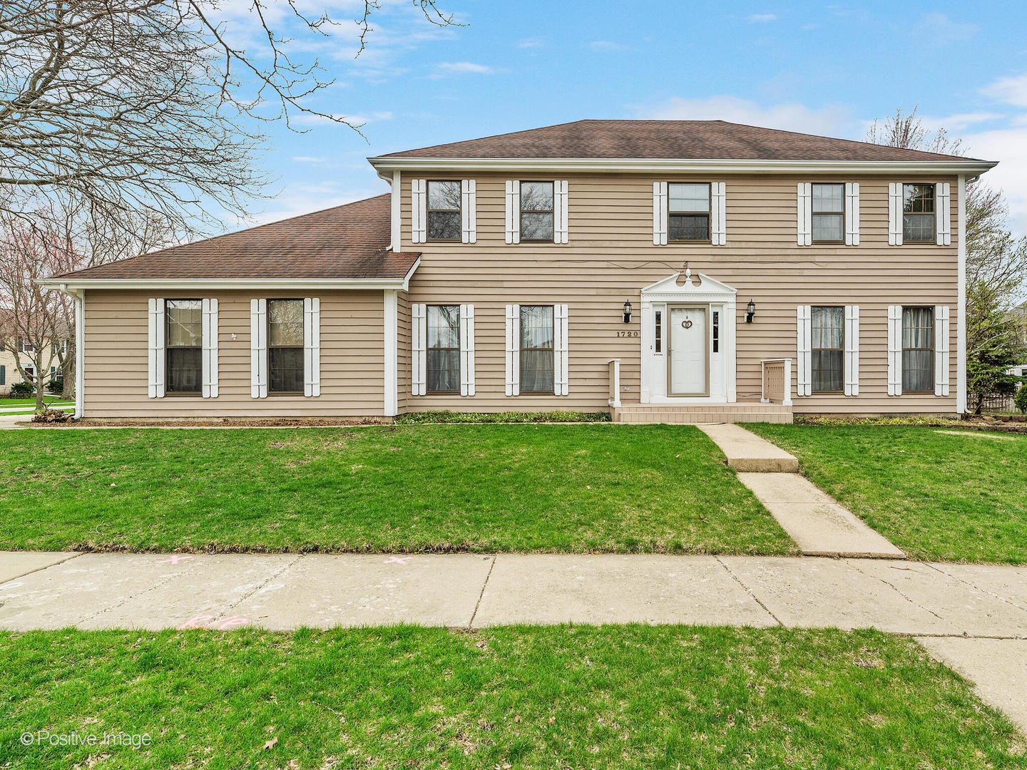 front view of a house with a yard