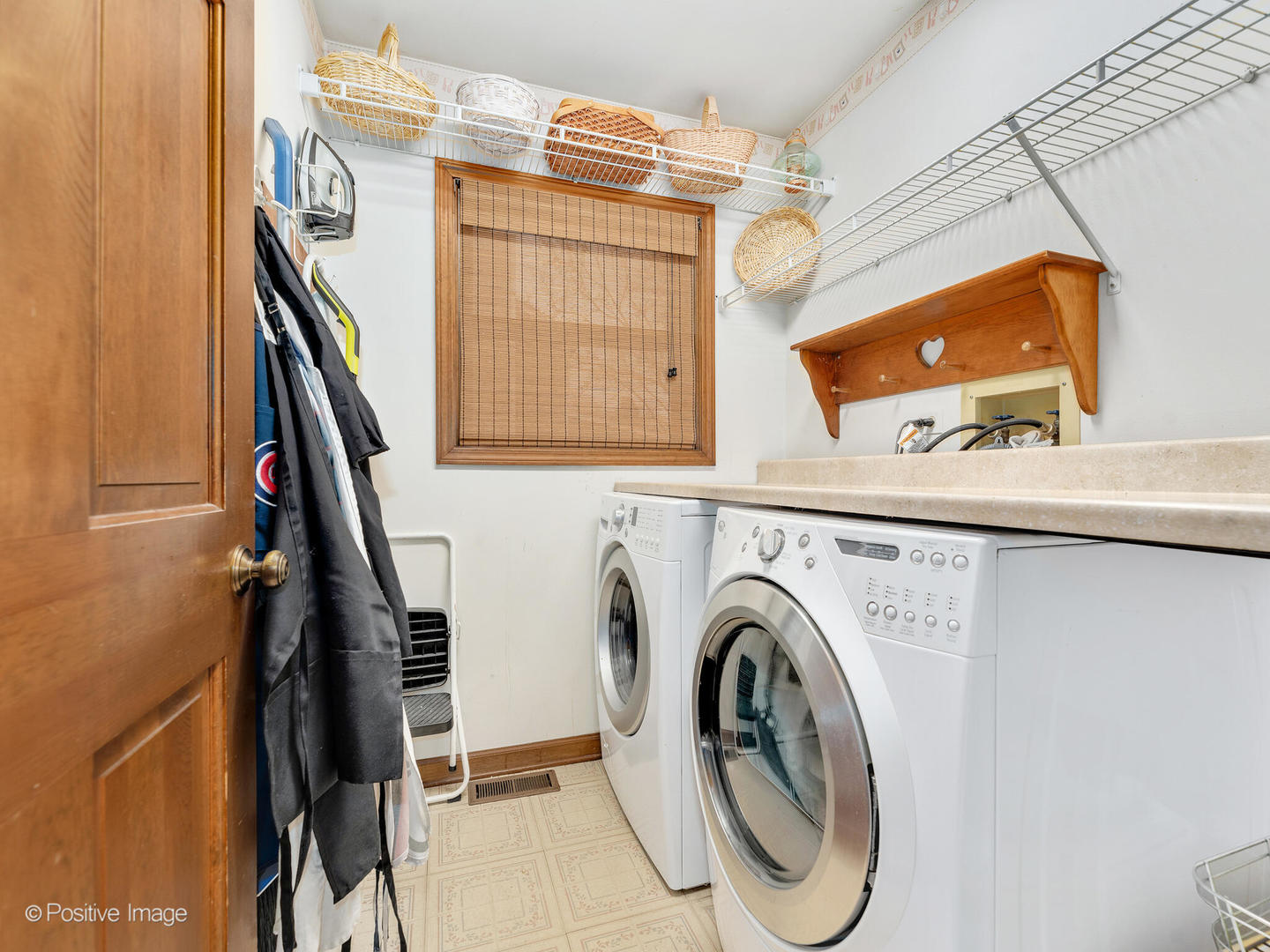 1720 East Bailey Road Naperville, IL 60565 - Photo 15 of 31 a view of a storage & utility room with washer and dryer