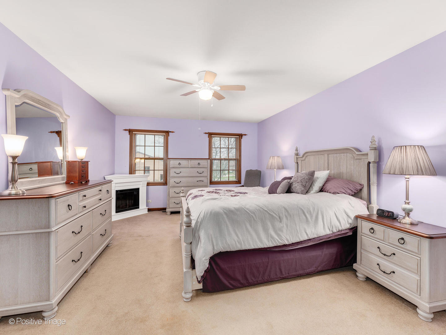 1720 East Bailey Road Naperville, IL 60565 - Photo 16 of 31 a spacious bedroom with bed and a chandelier