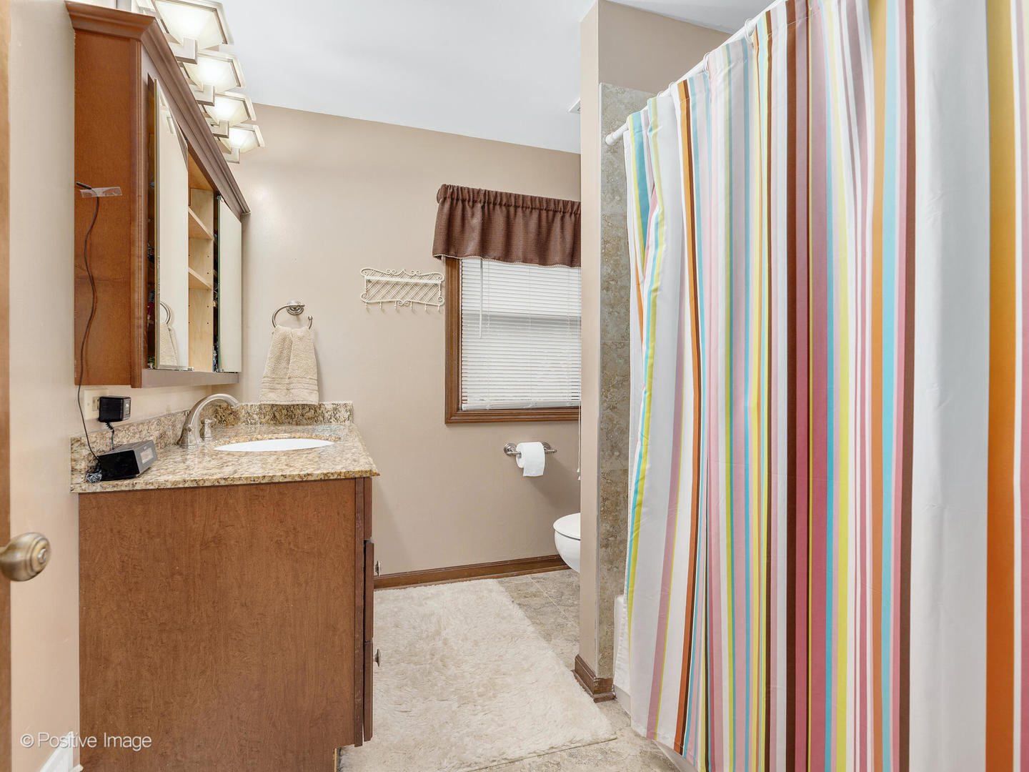 1720 East Bailey Road Naperville, IL 60565 - Photo 17 of 31 a bathroom with a granite countertop sink and a mirror