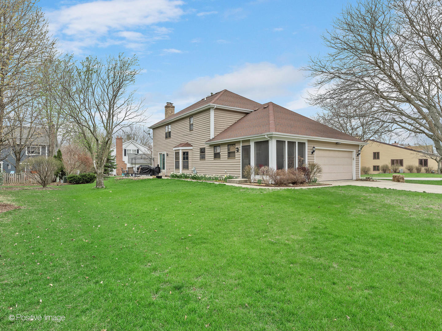1720 East Bailey Road Naperville, IL 60565 - Photo 28 of 31 a front view of a house with a garden and trees
