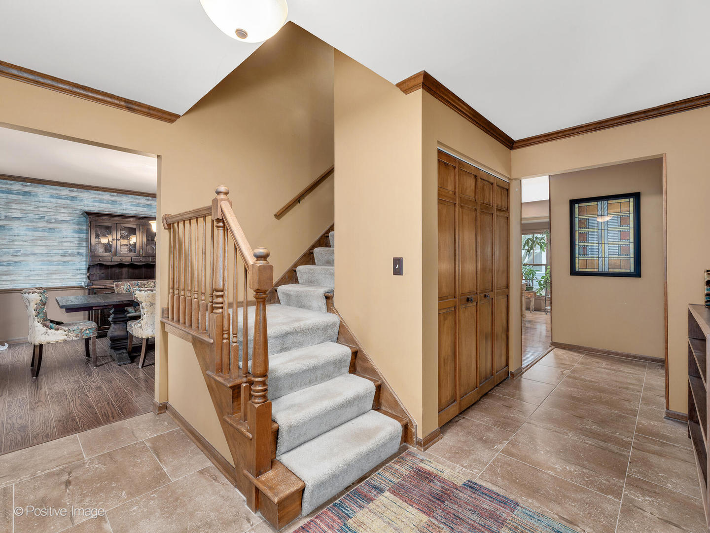 1720 East Bailey Road Naperville, IL 60565 - Photo 3 of 31 a view of a hallway with entryway and stairs