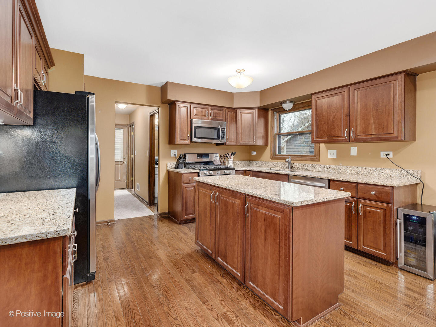1720 East Bailey Road Naperville, IL 60565 - Photo 10 of 31 a kitchen with stainless steel appliances granite countertop a sink stove and refrigerator