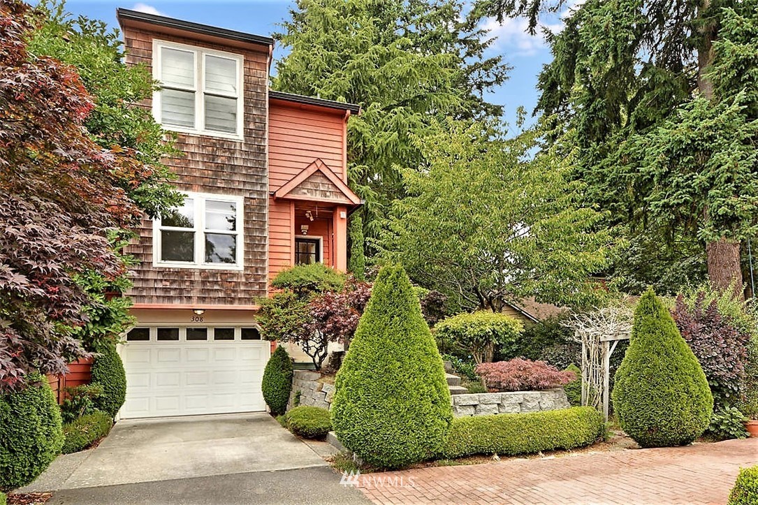 308 North 133rd Street Seattle, WA 98133 - Photo 2 of 18 a front view of a house with a garden