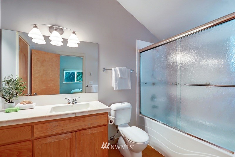 308 North 133rd Street Seattle, WA 98133 - Photo 11 of 18 a bathroom with a sink a toilet and shower