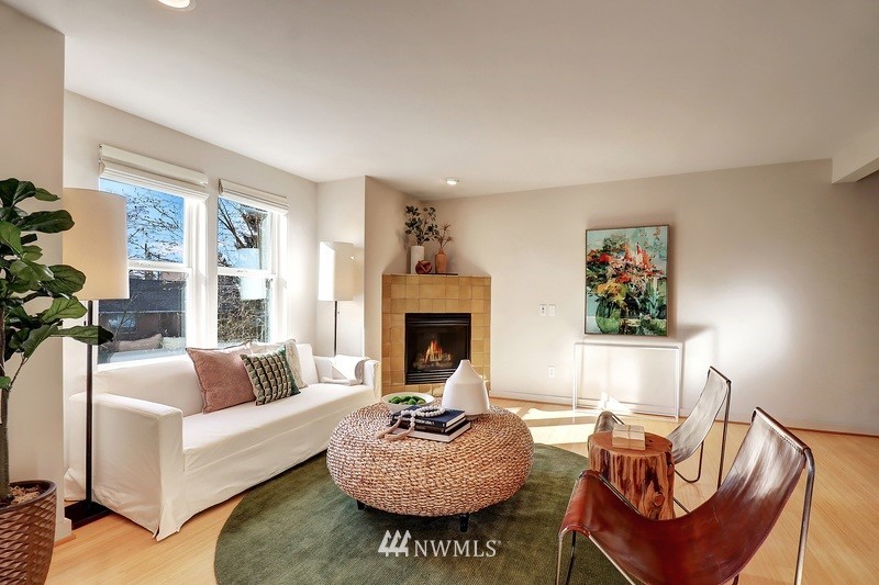 308 North 133rd Street Seattle, WA 98133 - Photo 3 of 18 a living room with furniture a window and a fireplace