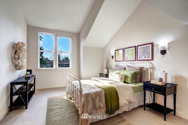 308 North 133rd Street Seattle, WA 98133 - Photo 9 of 18 a bedroom with a bed and wooden floor