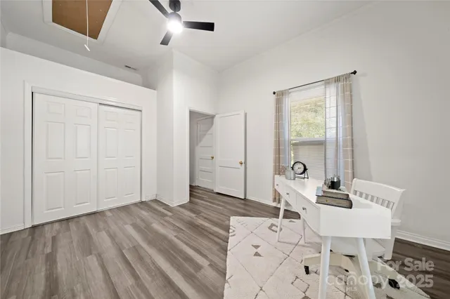 a view of a livingroom with furniture and wooden floor
