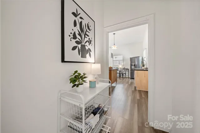 a dining room with furniture and wooden floor