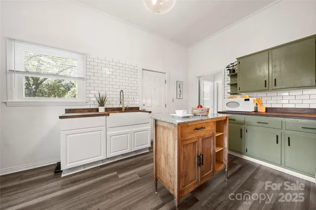 a kitchen with sink cabinets and window