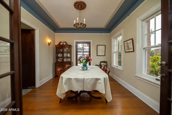 a view of an entryway with wooden floor and stairs