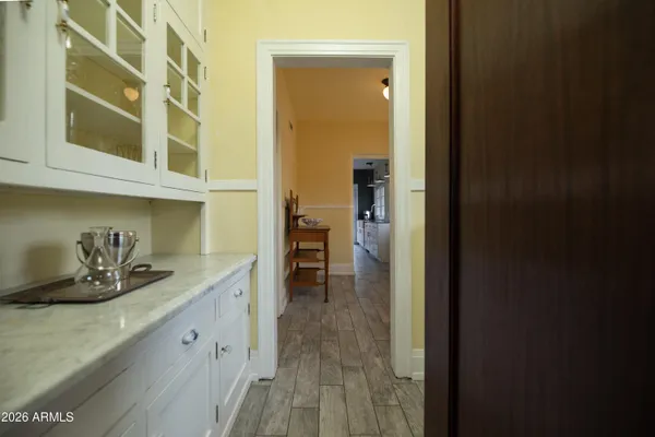 a bedroom with a bed and a mirror