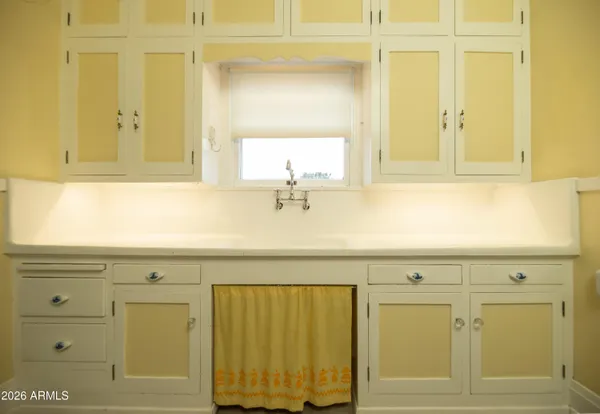 a bathroom with a toilet a sink and a mirror