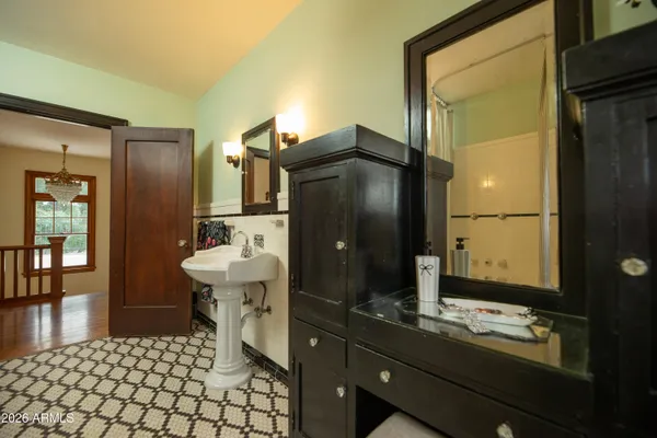 a kitchen with granite countertop a stove a sink and a refrigerator