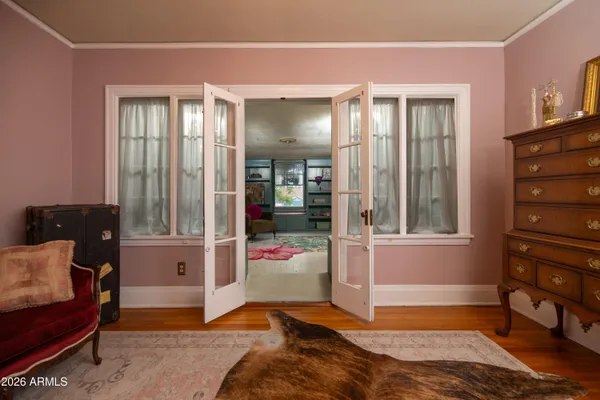 a view of a backyard with table and chairs and potted plants