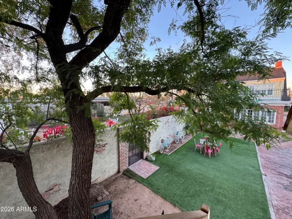 a view of backyard with a garden and entertaining space