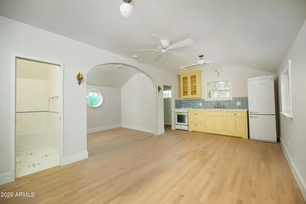 a view of a house and a yard and a street