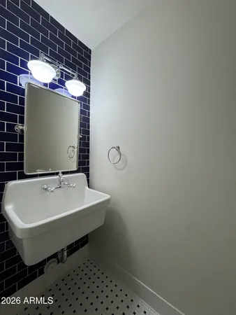 a front view of a house with a yard and table and chairs