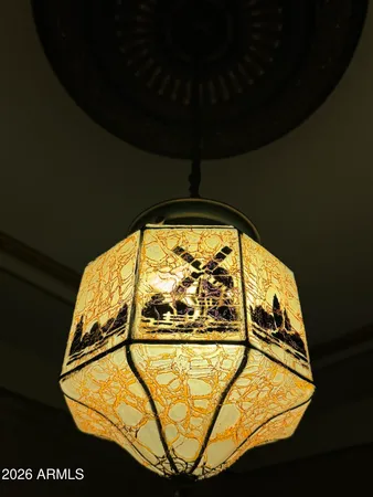 a living room with furniture a dining table and a fireplace