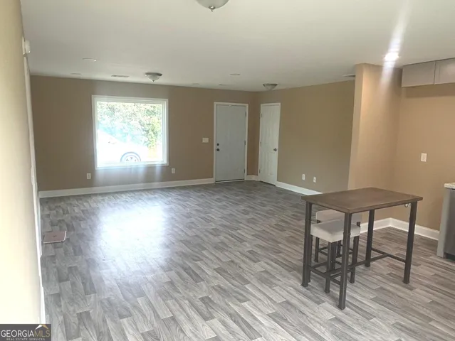 a view of livingroom with furniture window and wooden floor