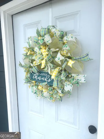 a kitchen with a sink cabinets and wooden floor