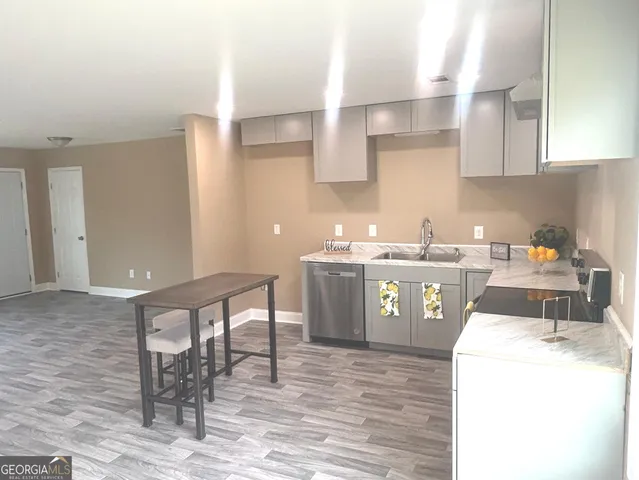 a bathroom with a toilet and a bath tub