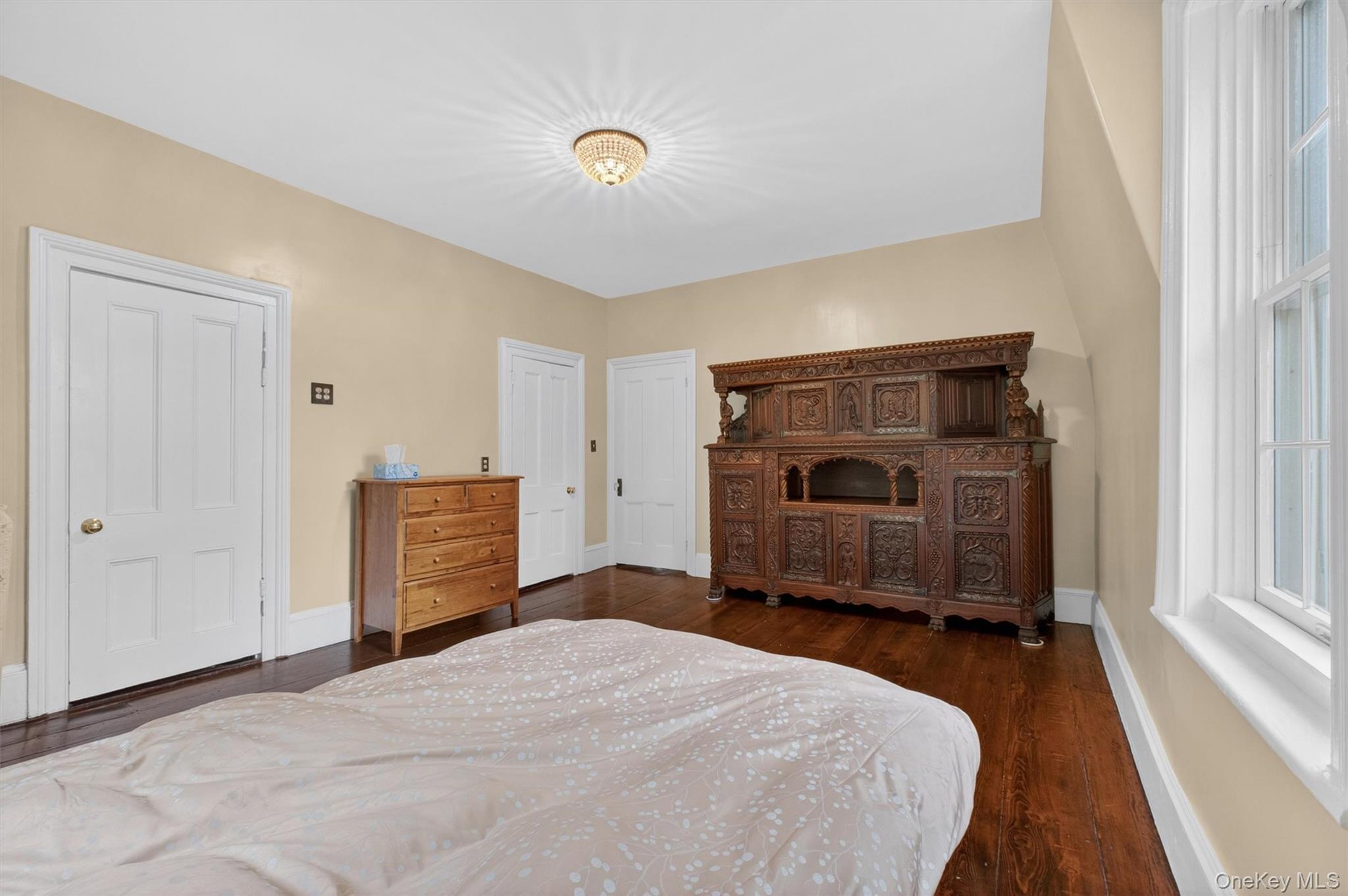 121 Old Glenham Road Fishkill, NY 12524 - Photo 32 of 50 Room featuring wide-plank wood flooring, light-toned walls, white trim,closet, and large windows.