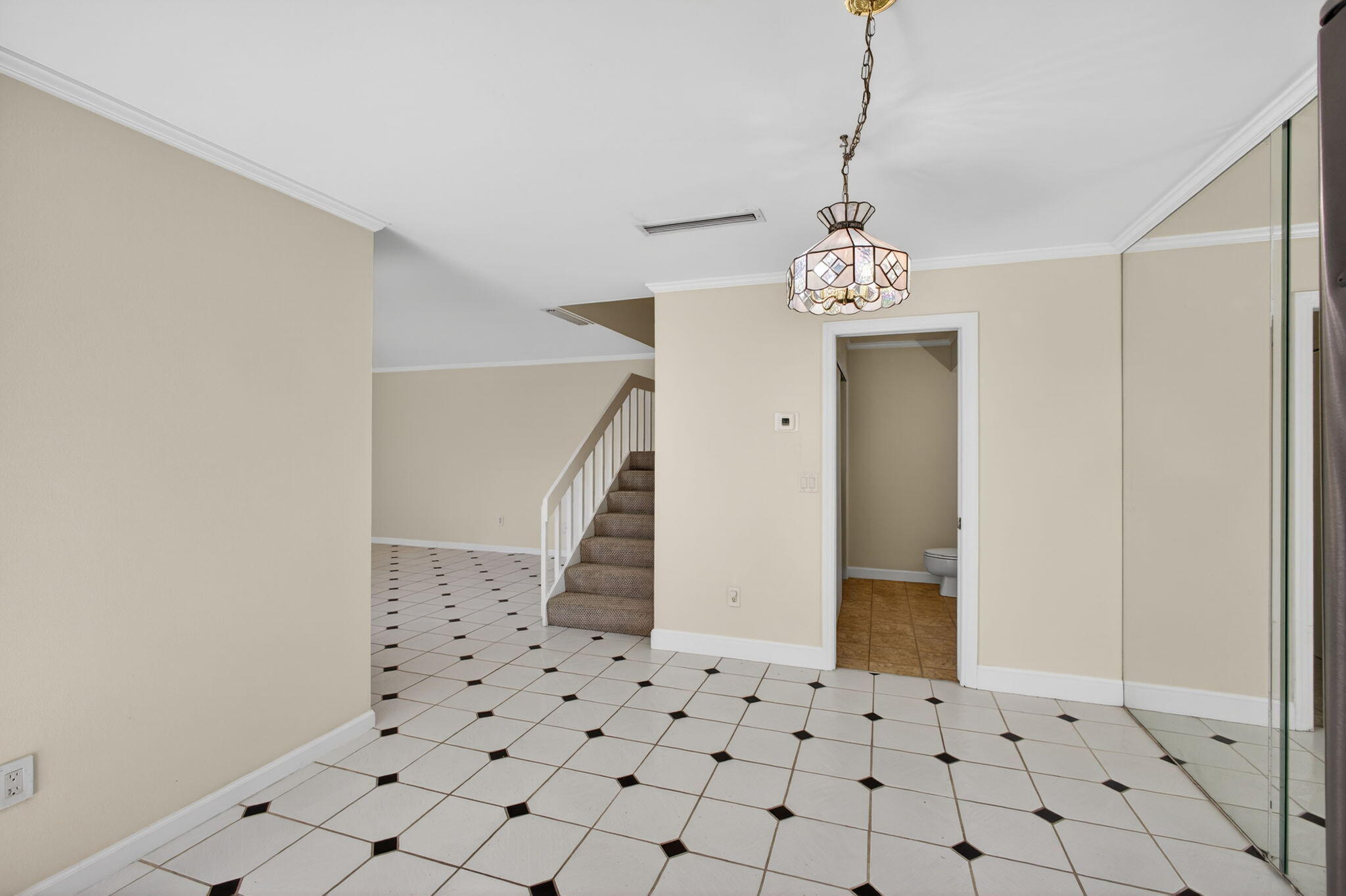 825 Center Street, Unit 9A Jupiter, FL 33458 - Photo 16 of 52 a view of a hallway with windows and chandelier