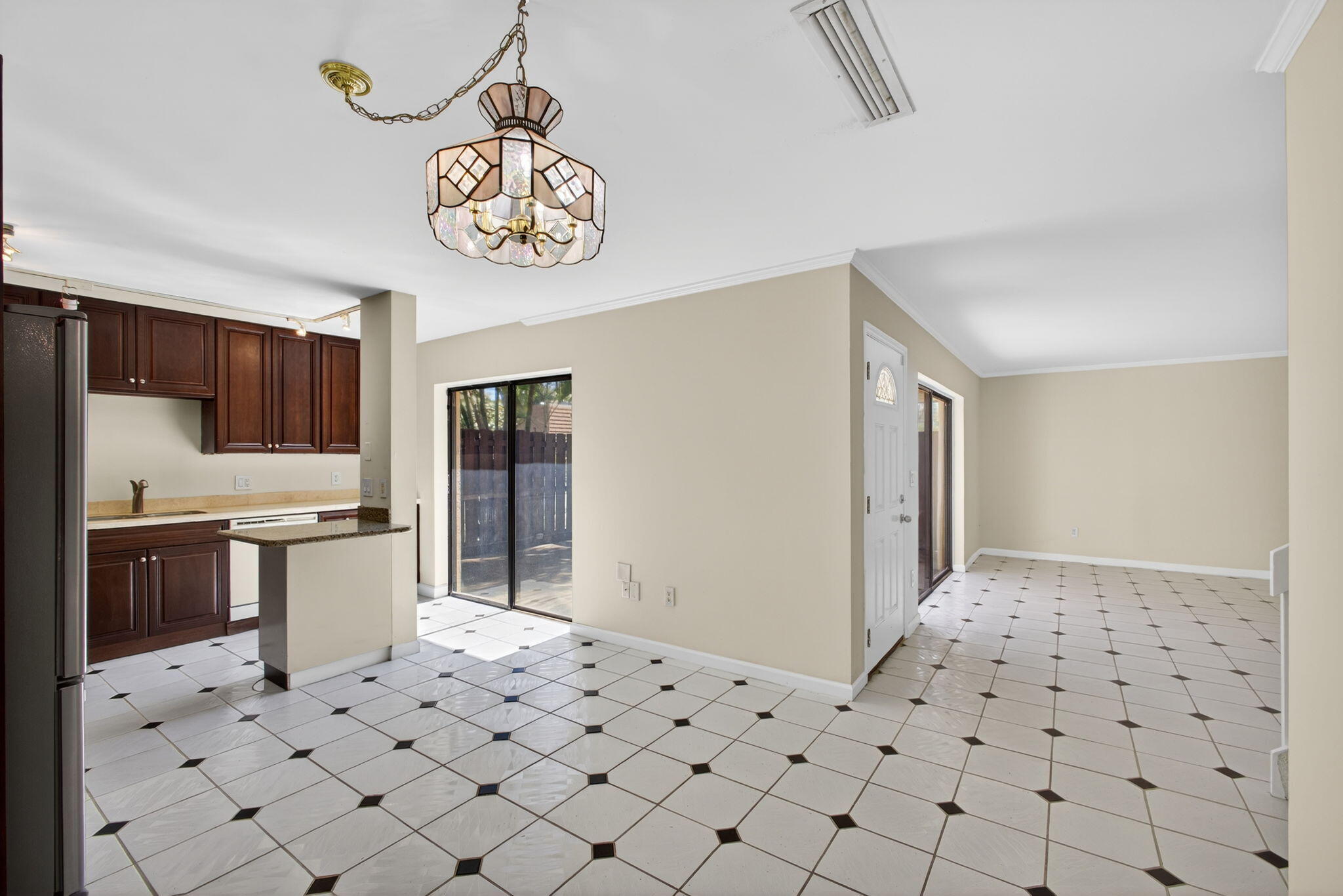 825 Center Street, Unit 9A Jupiter, FL 33458 - Photo 17 of 52 a kitchen with stainless steel appliances a stove a sink and a refrigerator